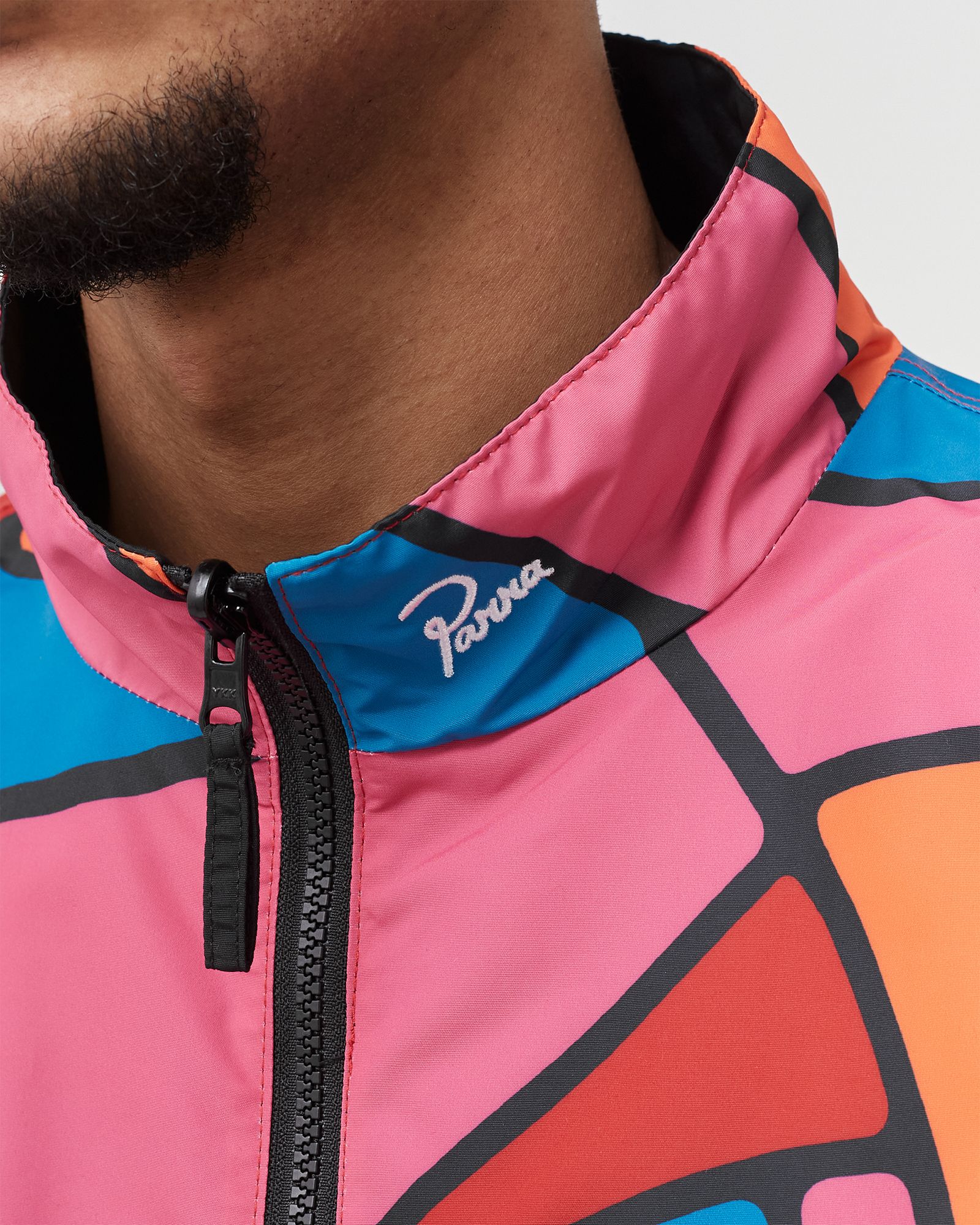 serpent pattern track top