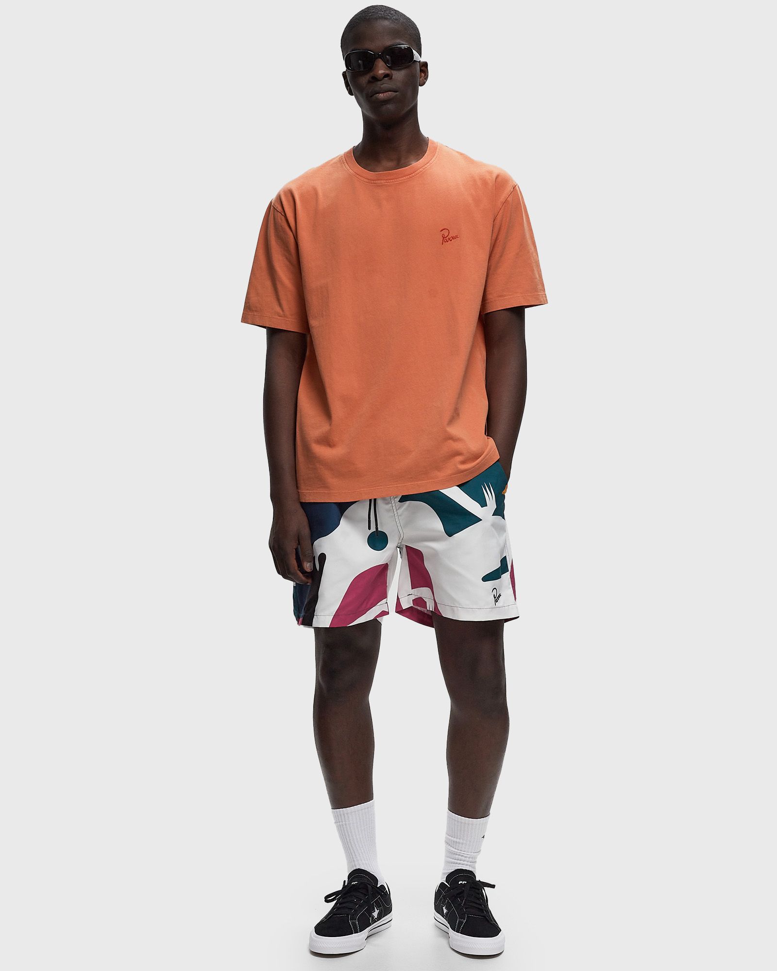 beached in swim shorts