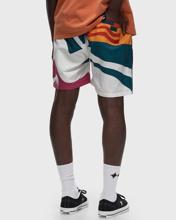 beached in swim shorts