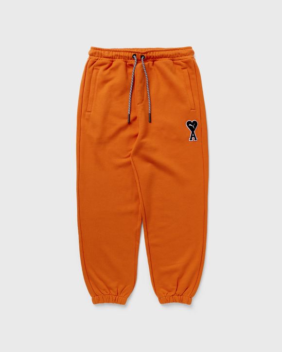 Orange puma sweatpants sale