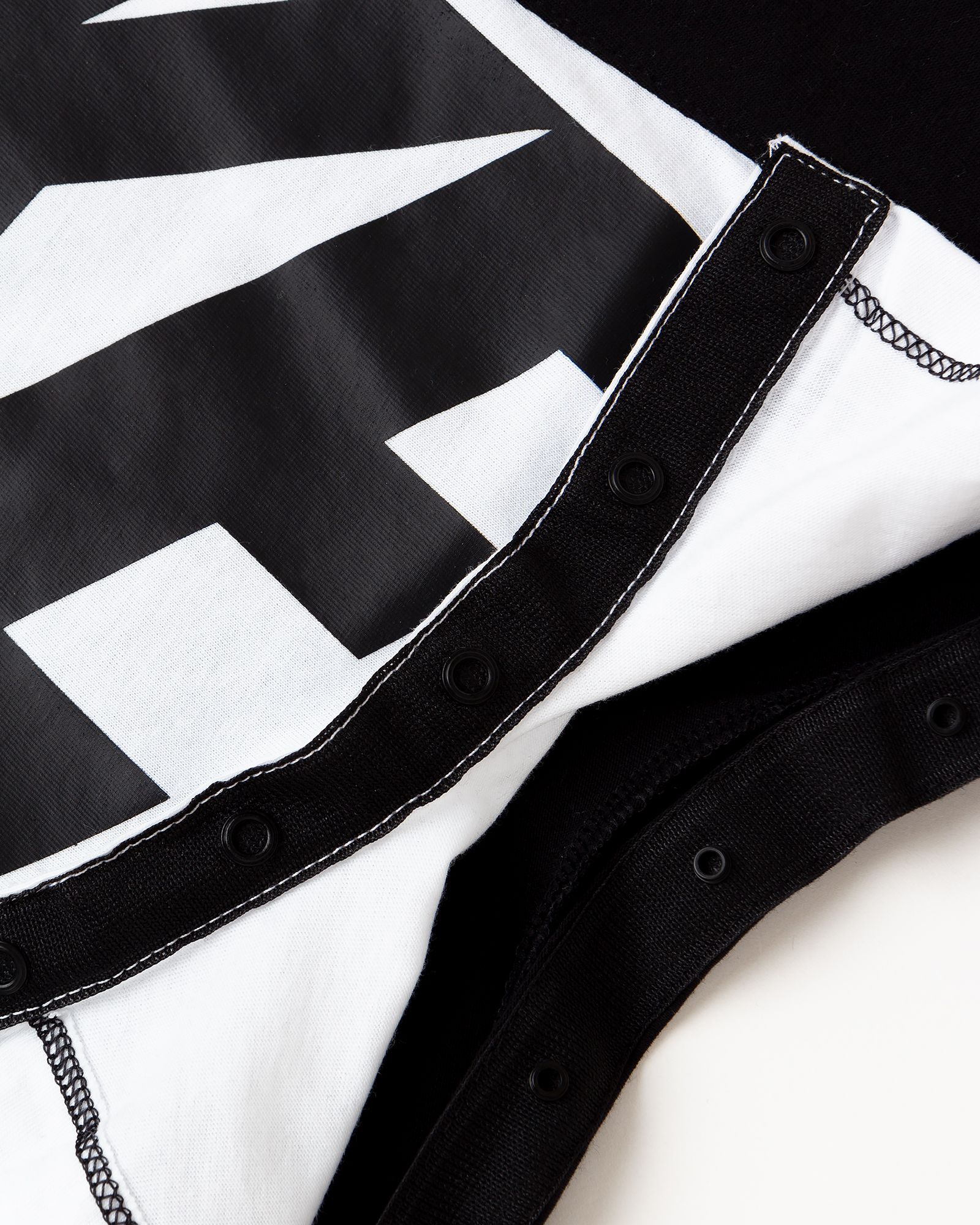 AMPLIFY HOODED ROMPER