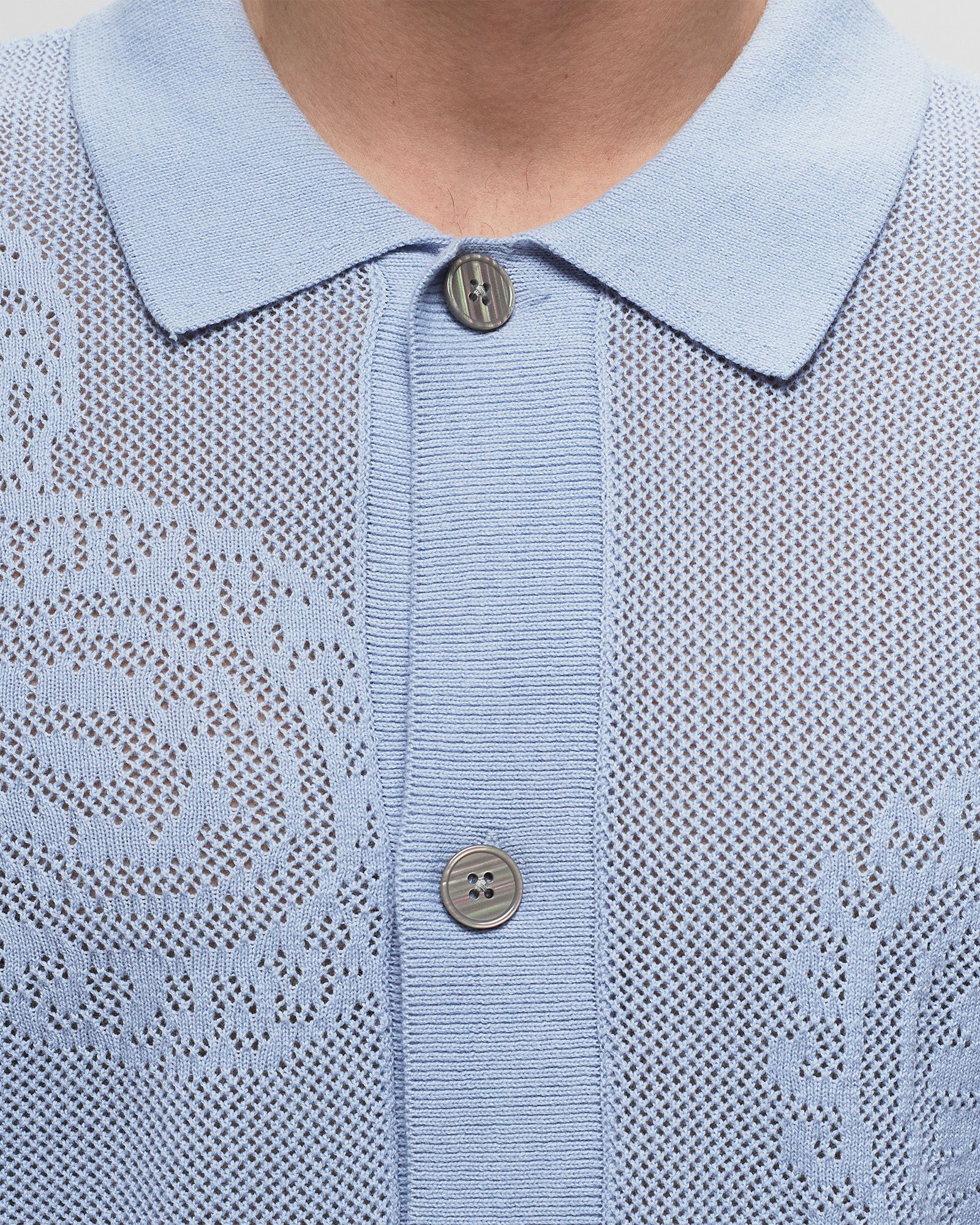 Tear drop open knit shirt