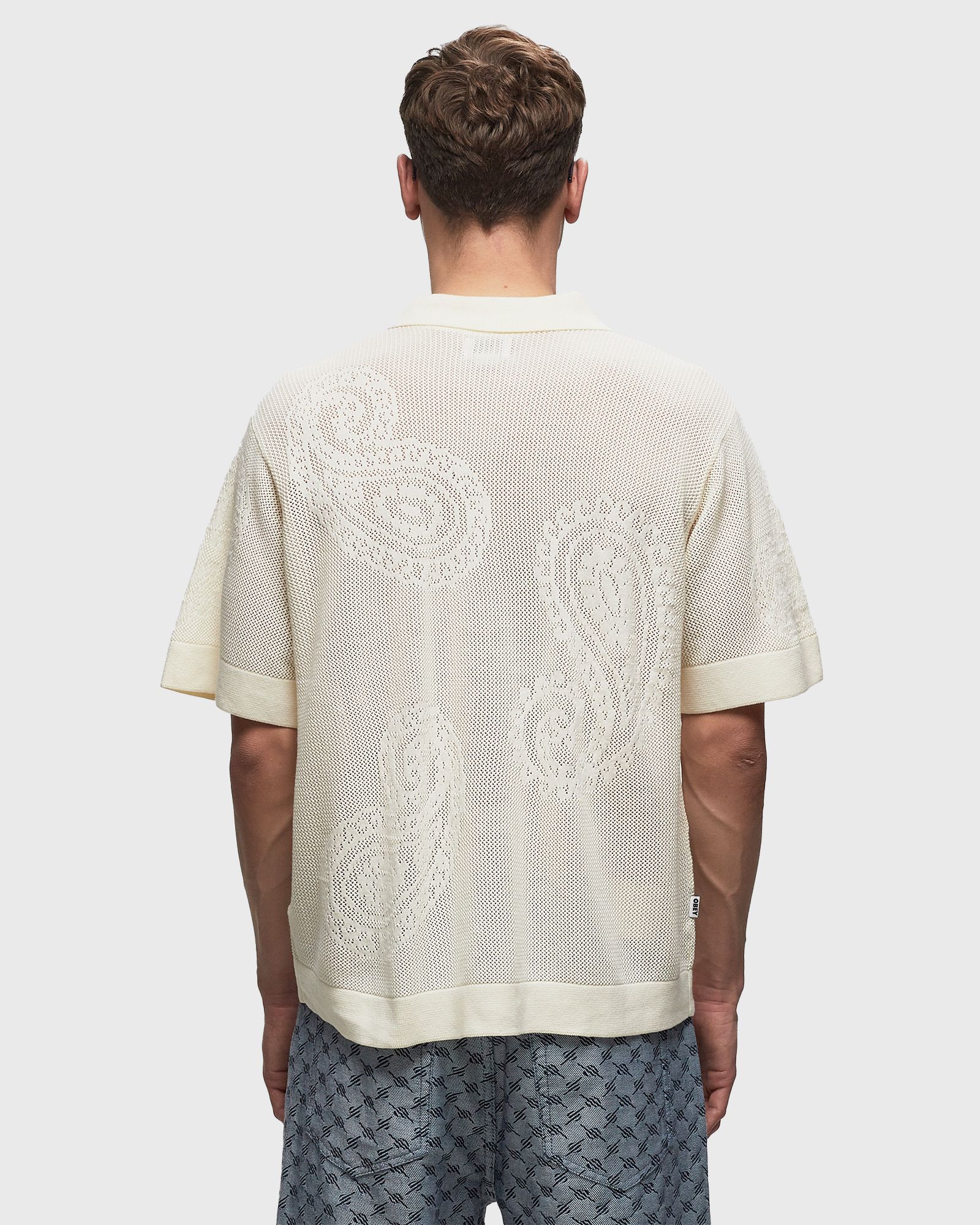 Tear drop open knit shirt