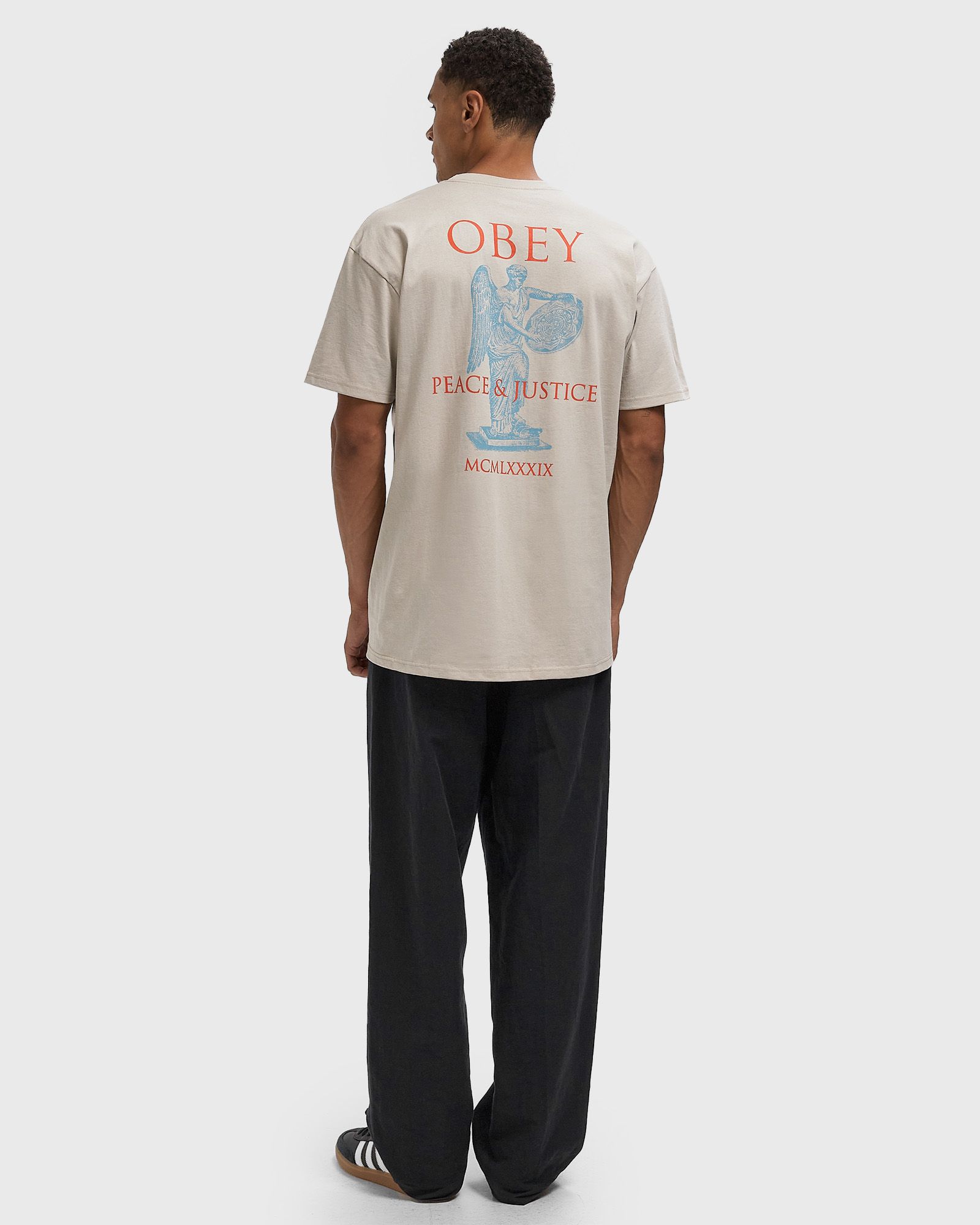 Obey peace & justice statue