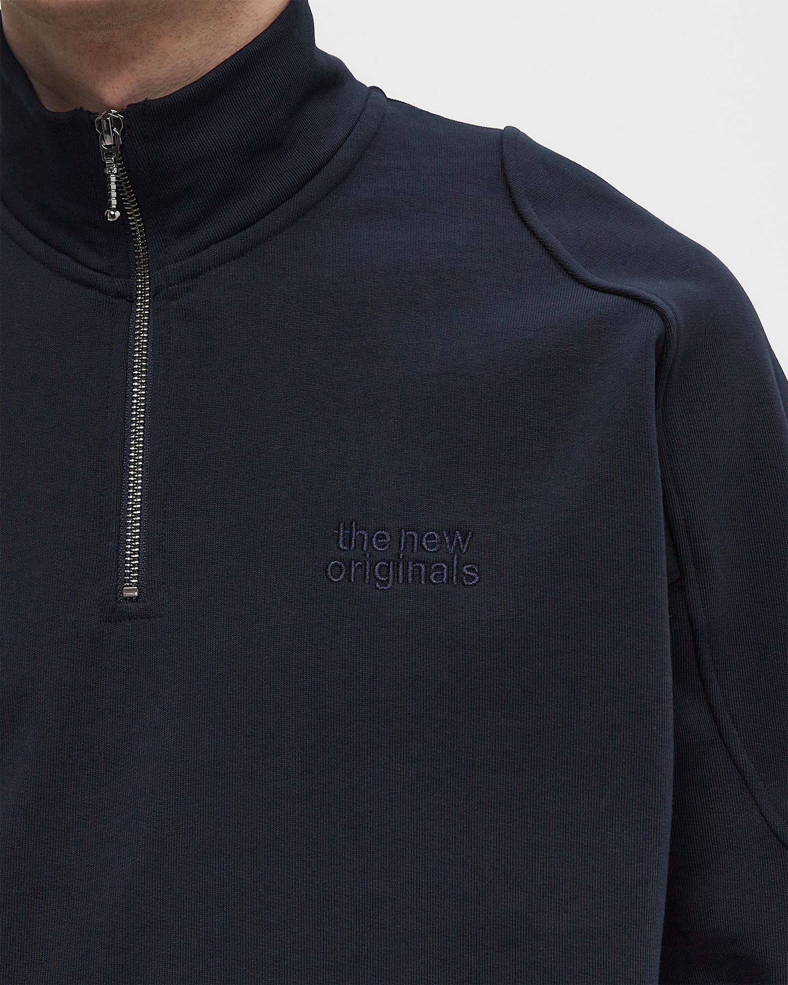 EMBLEM HALF-ZIP SWEATER