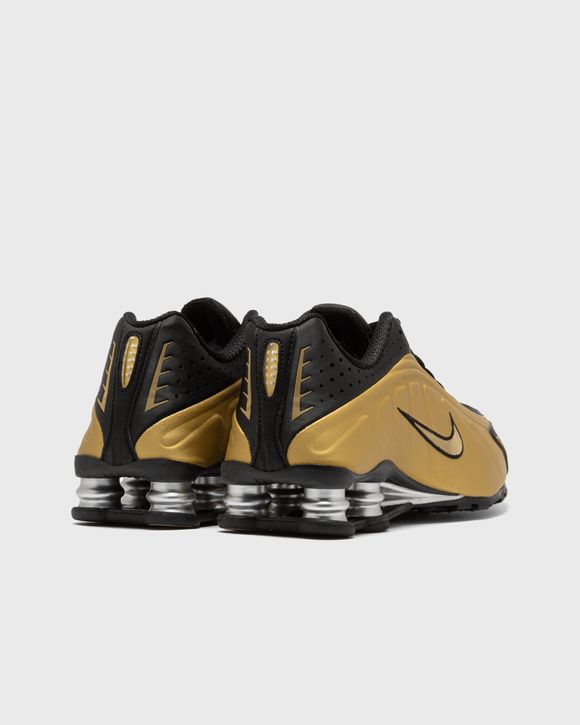 Black gold nike shox sales
