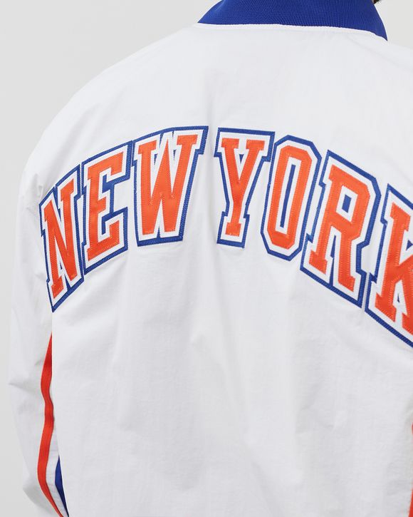 thumbnail interactive-video image 1 of Cheap Mitchell And Ness Knicks Warm Up Jacket Sale Mitchell Ness NBA New York Knicks Exploded Logo Warm Up Jacket 1 of 10