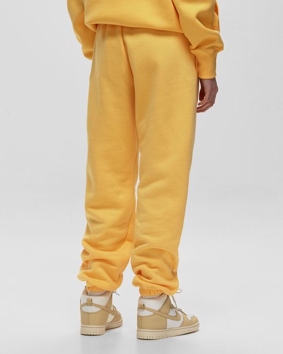 Nike mini swoosh oversized yellow joggers hot sale