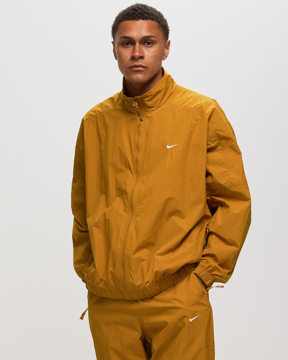 Nike swoosh track top sale