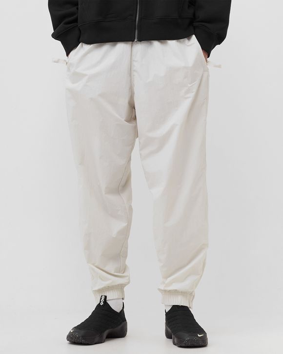 Nike white swoosh track pants hot sale