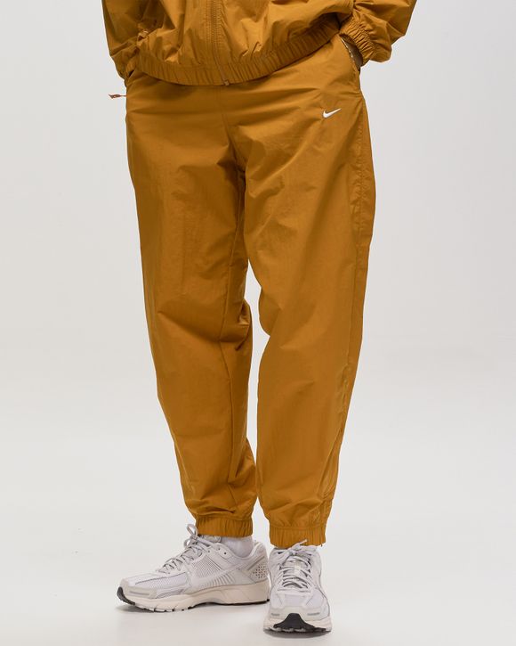 Nike Solo Swoosh Track Pants en color Amarelo