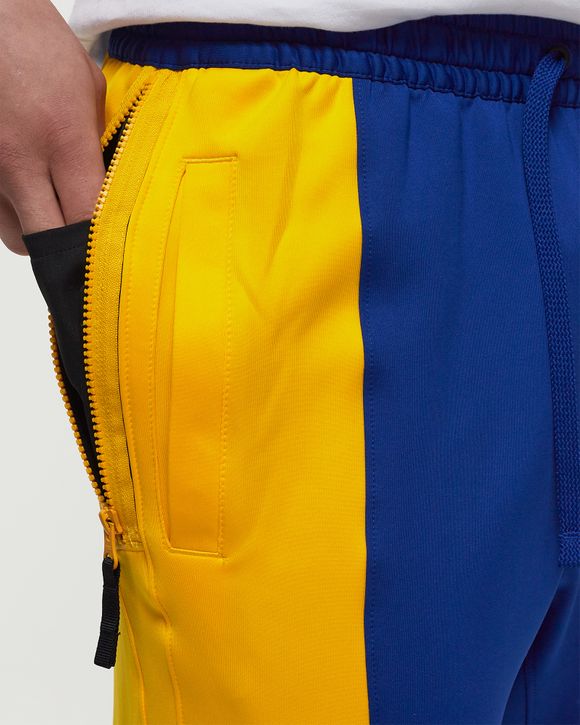 Blue and yellow nike 2024 pants