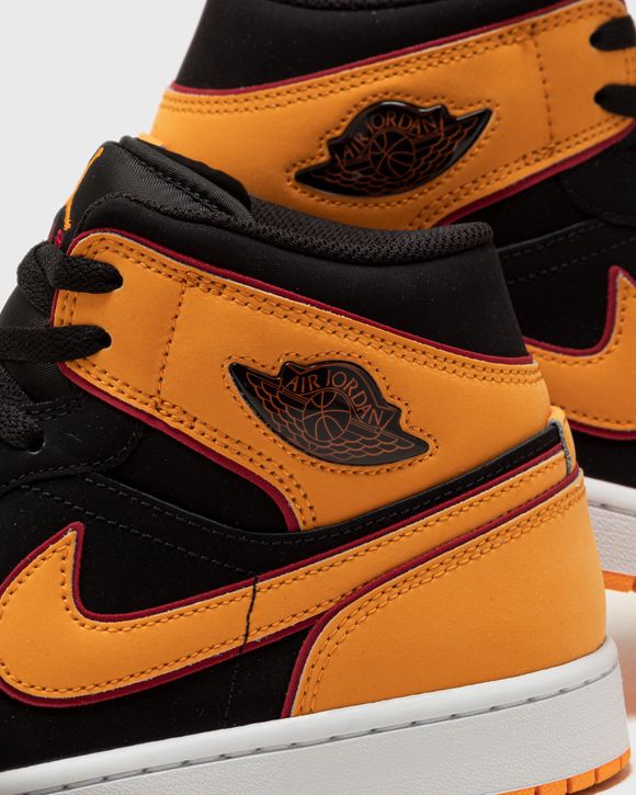 Nike Air Jordan 1 Mid sneakers in orange and black