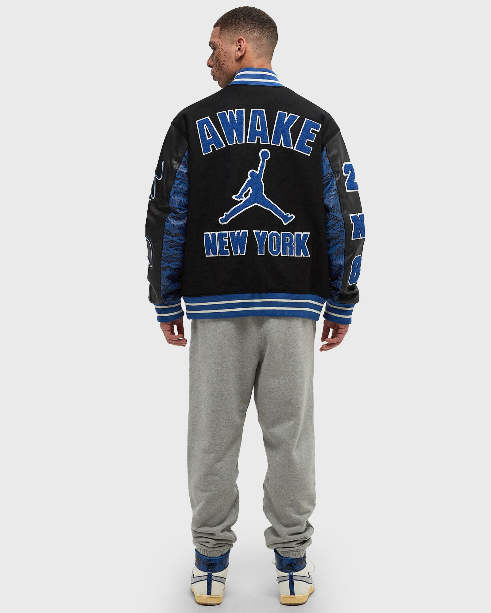 Jordan x AWAKE NY VARSITY JACKET Black Blue | BSTN Store