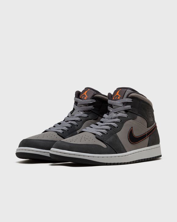 Black and grey jordan hotsell 1 mid