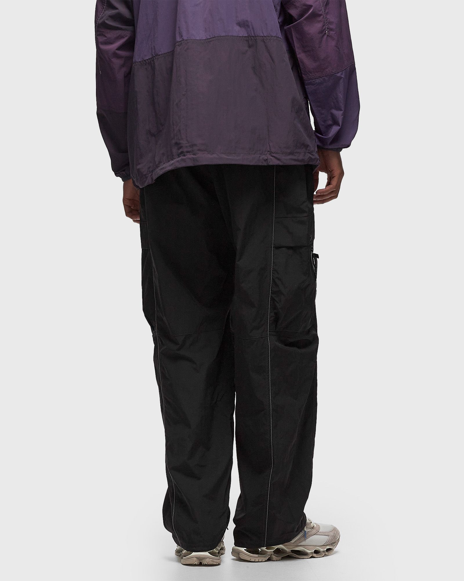 Gramicci x AND WANDER PATCHWORK WIND PANT Black | BSTN Store