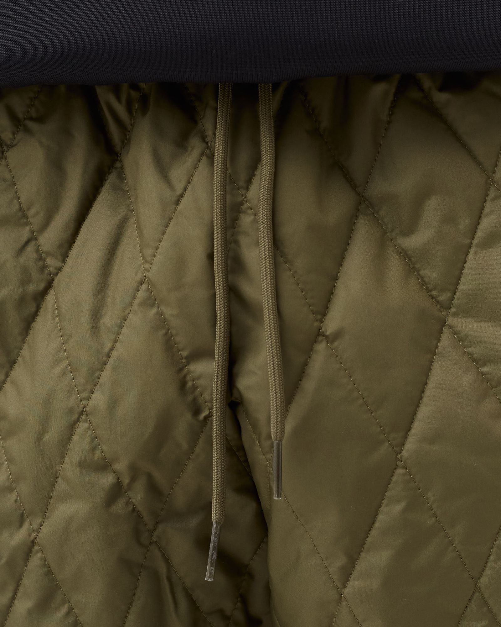 QUILTED SST TRACK TOP