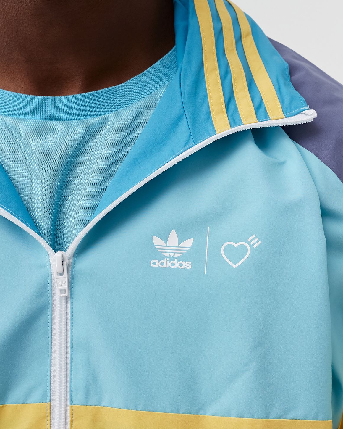 Adidas ADIDAS X HUMAN MADE WINDBREAKER Blue | BSTN Store