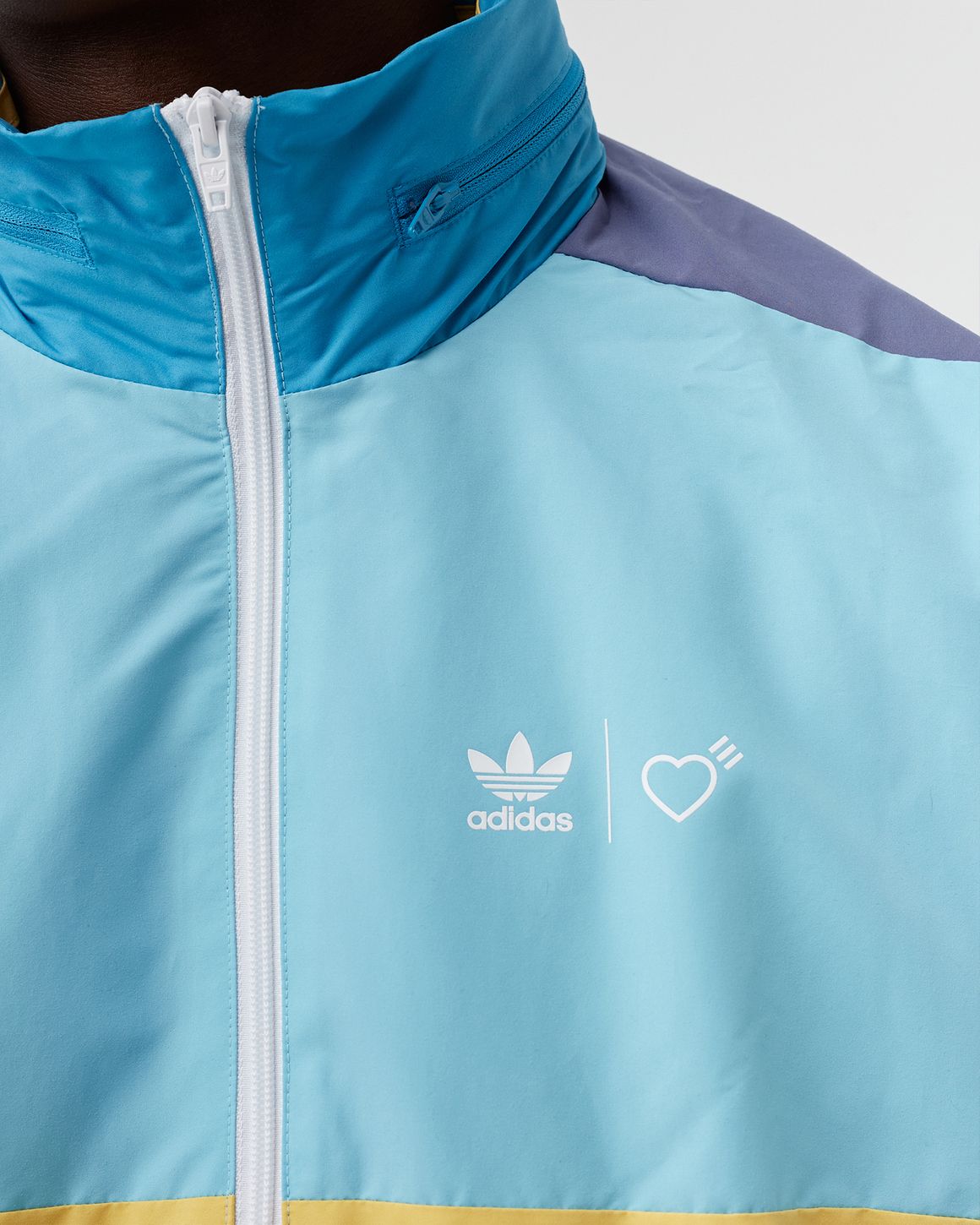 Adidas ADIDAS X HUMAN MADE WINDBREAKER Blue | BSTN Store