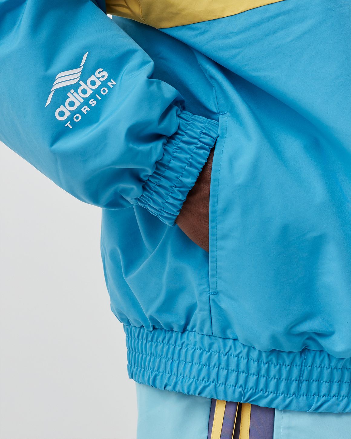 Adidas ADIDAS X HUMAN MADE WINDBREAKER Blue | BSTN Store