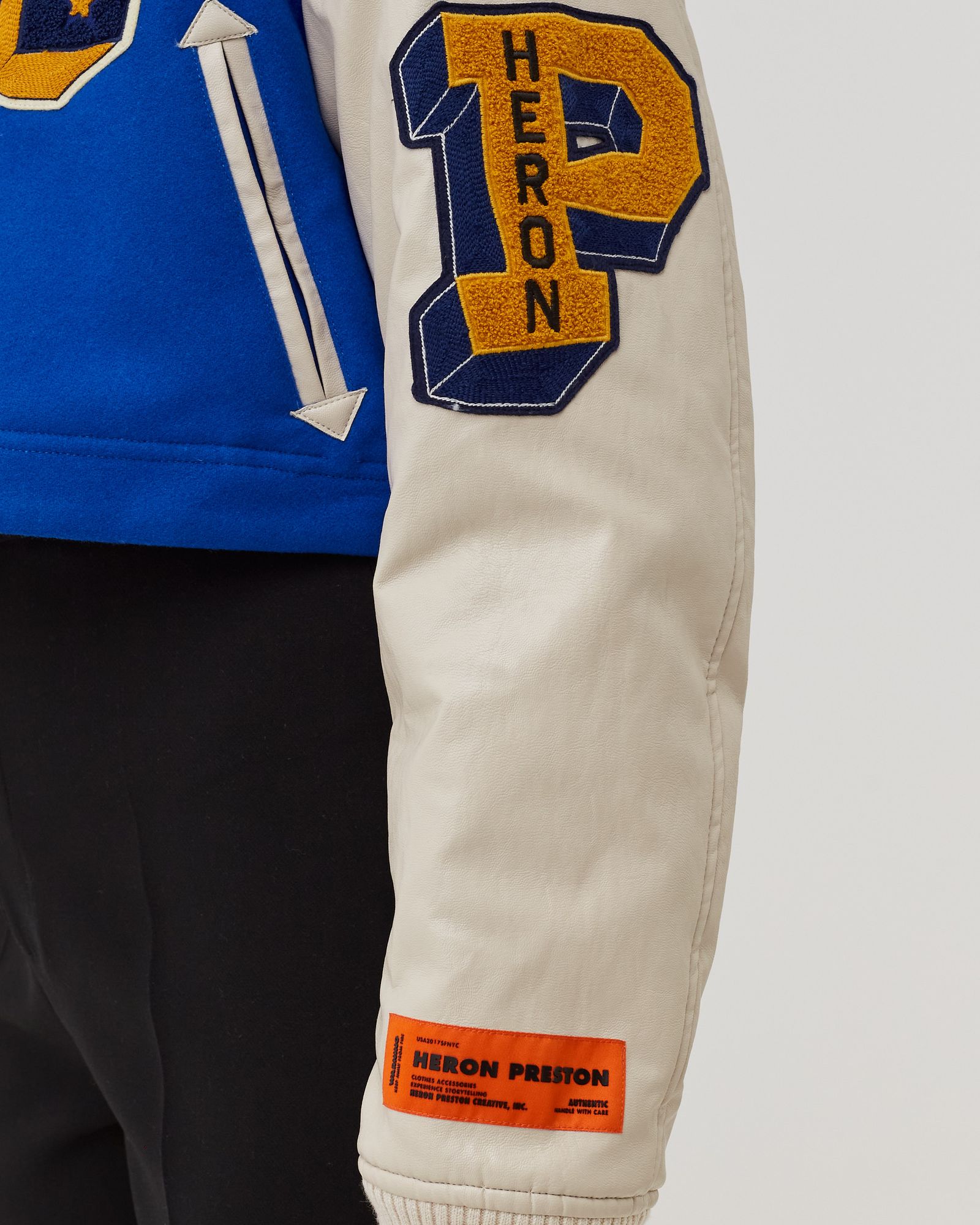 Heron Preston WMNS HERON PATCHES VARSITY JACKET Blue | BSTN