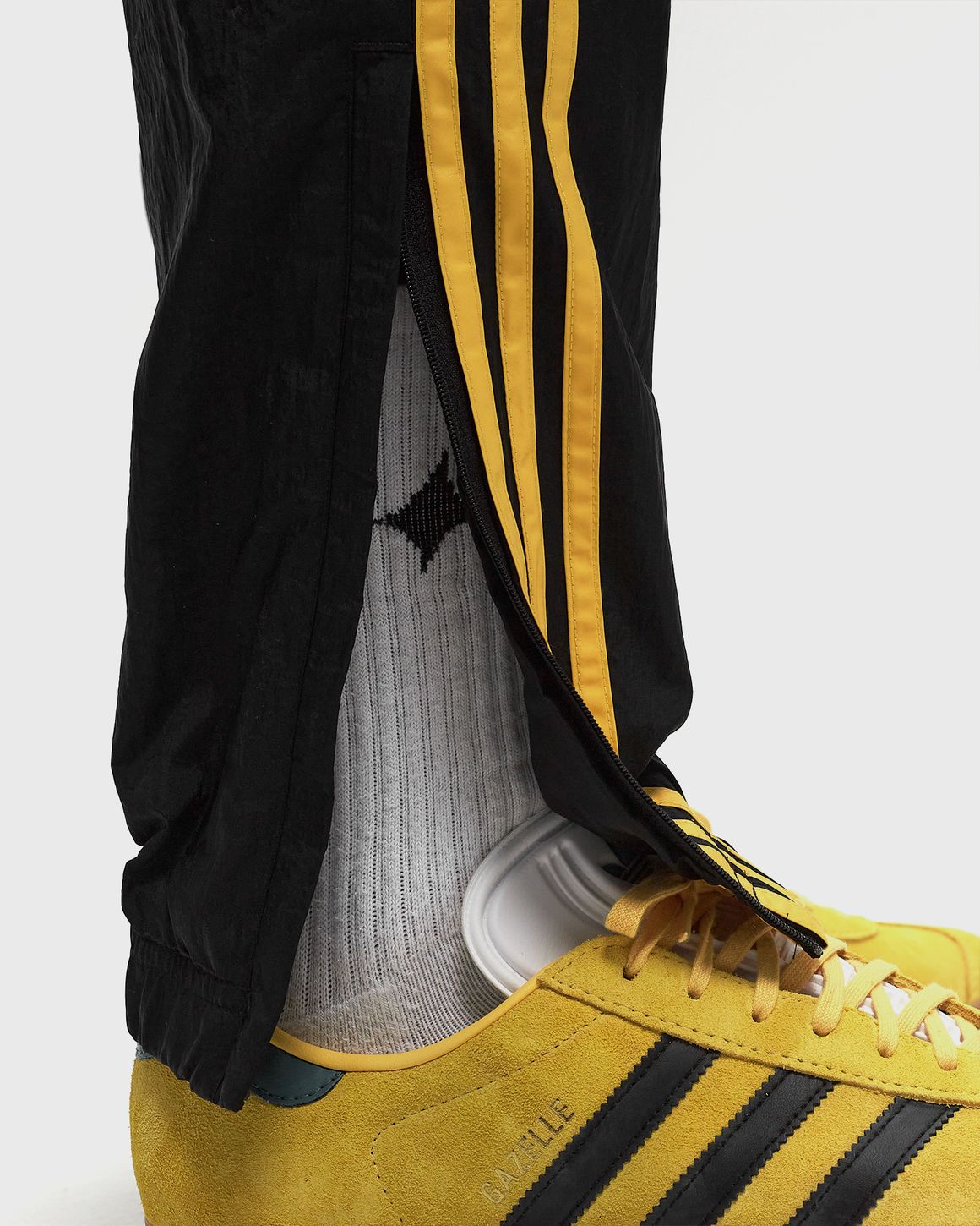 Black and yellow adidas pants online