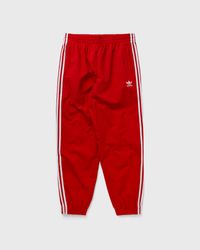 Adidas WOVEN FIREBIRD TRACK Pant Red | BSTN Store
