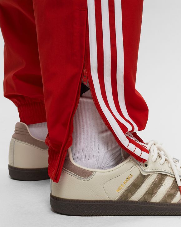 Adidas originals tape hot sale woven track pants