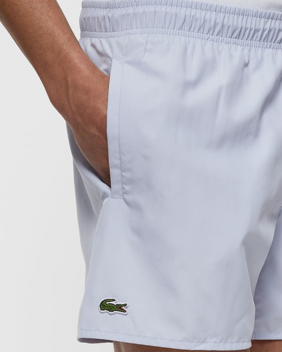 White lacoste on sale swim shorts