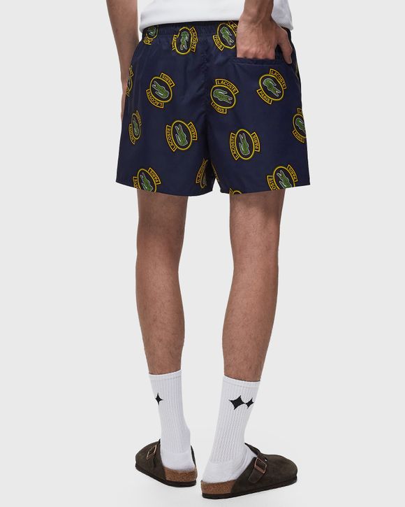 SHORT PRINTED SWIM TRUNKS