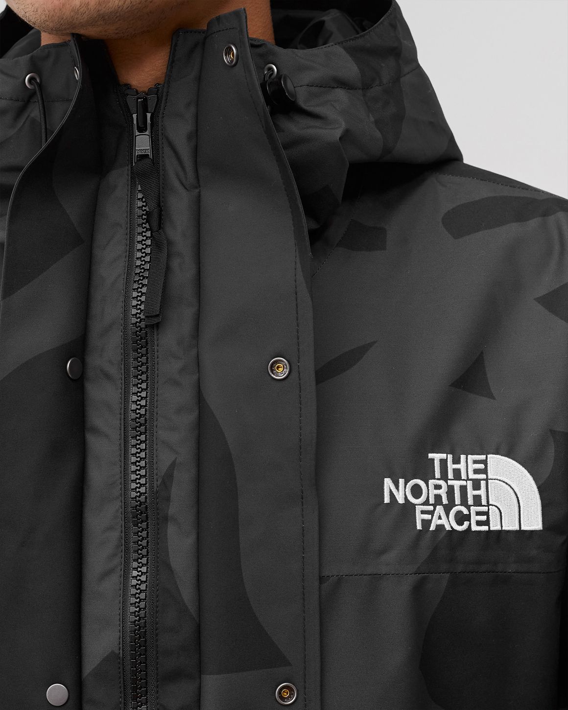 The North Face TNF X KAWS 'PROJECT X' RETRO 1986 MOUNTAIN JACKET Black |  BSTN Store