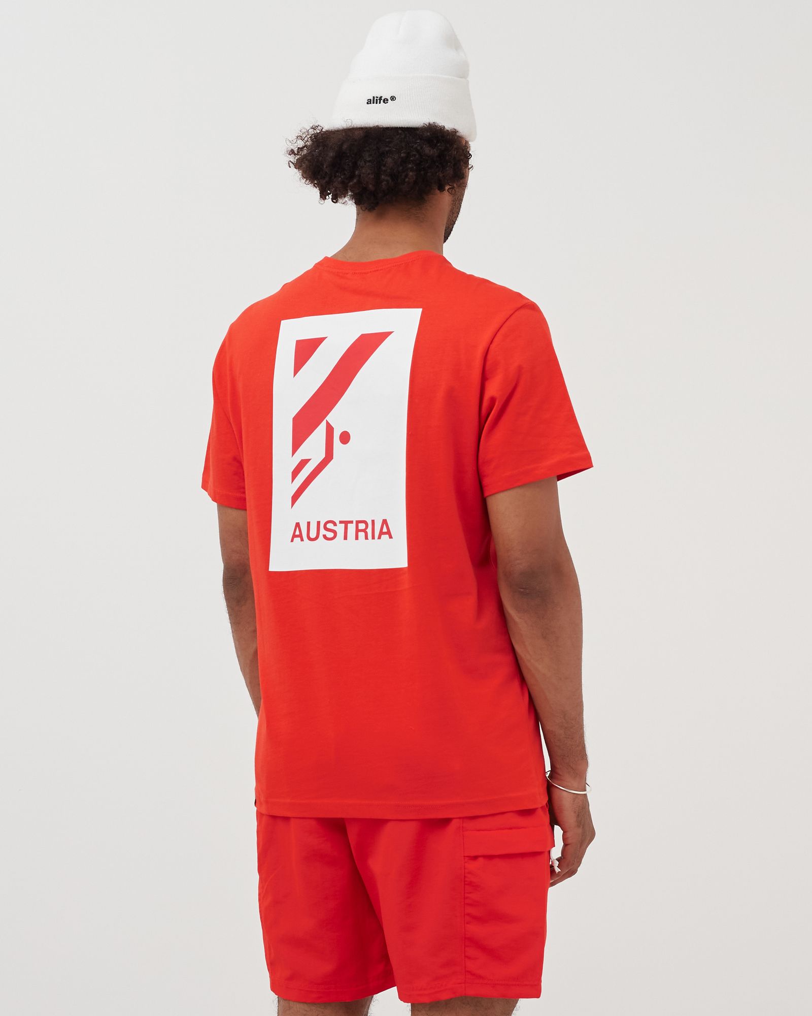 INTERNATIONAL COLLECTION CLIMB GRAPHIC TEE