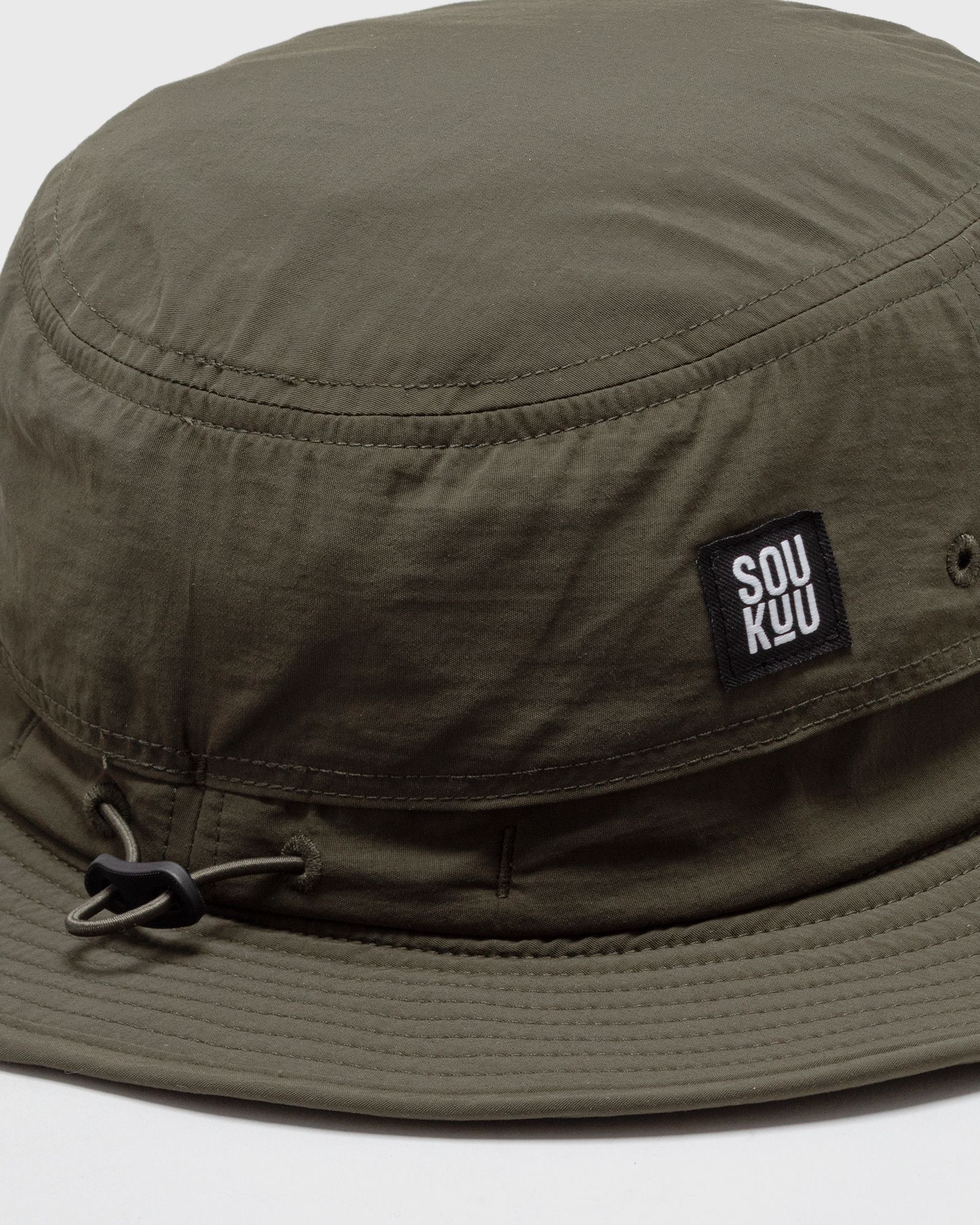 x UNDERCOVER HIKE SUN BRIMMER FOREST NIGHT GREEN