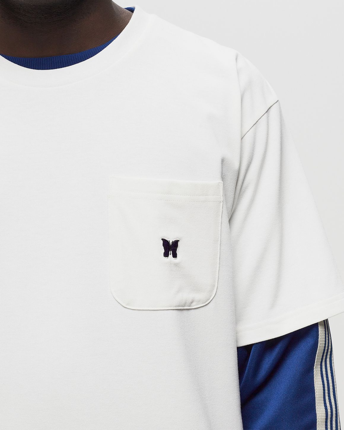 Needles S/S Crew Neck Tee White | BSTN Store Needles S/S Crew Neck Tee White | BSTN Store