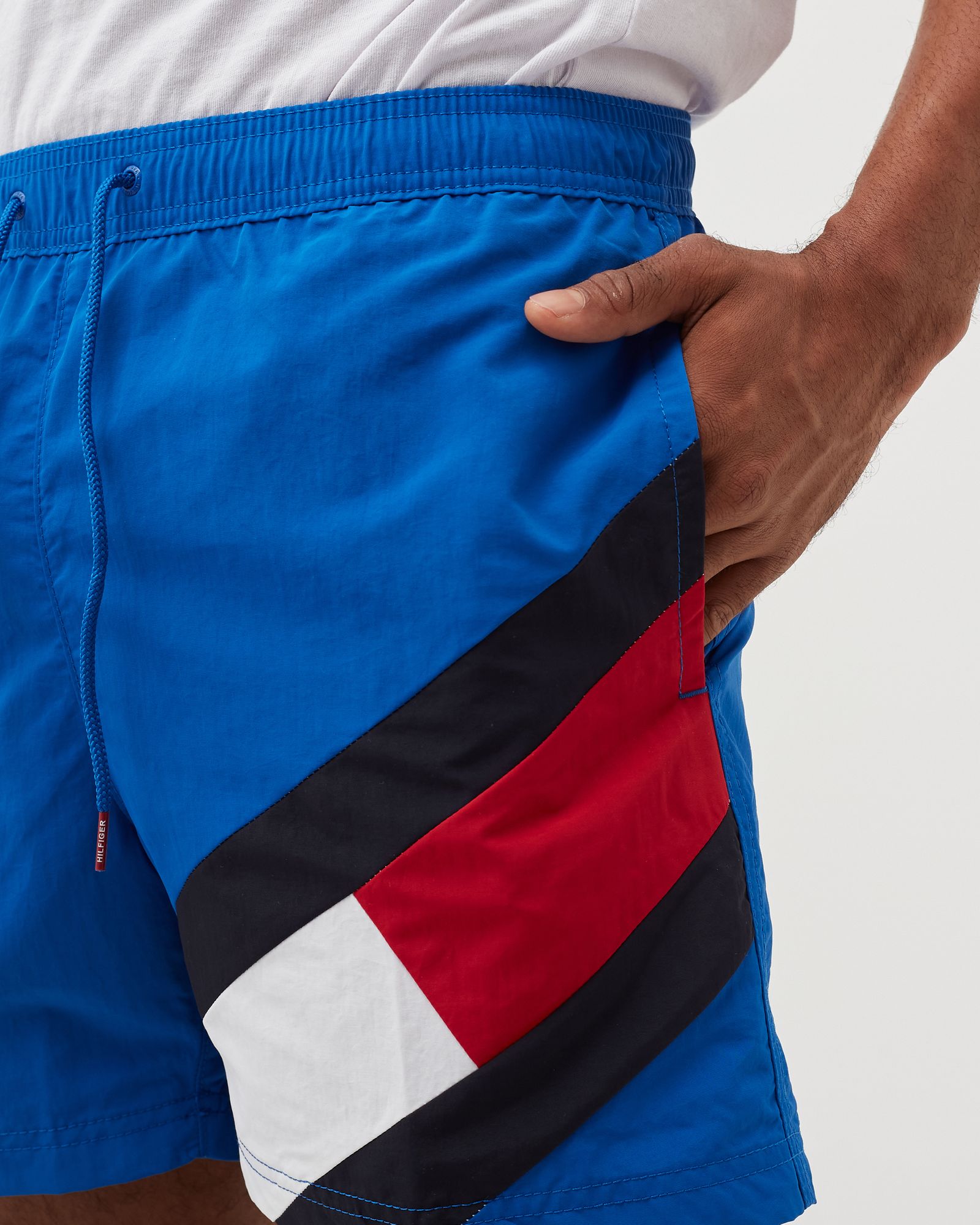 COLOUR-BLOCKED SLIM FIT MID LENGTH SWIM SHORTS
