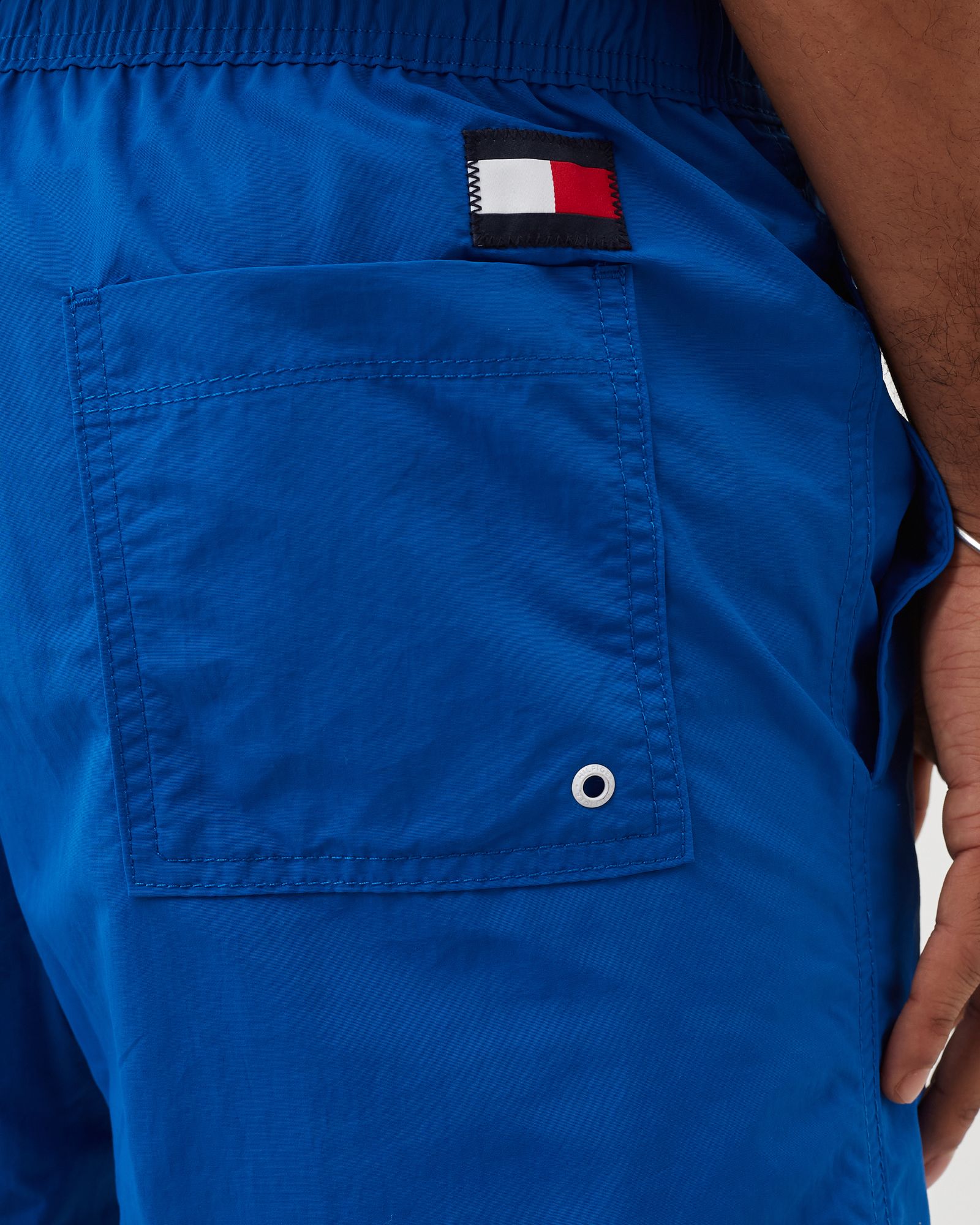 COLOUR-BLOCKED SLIM FIT MID LENGTH SWIM SHORTS