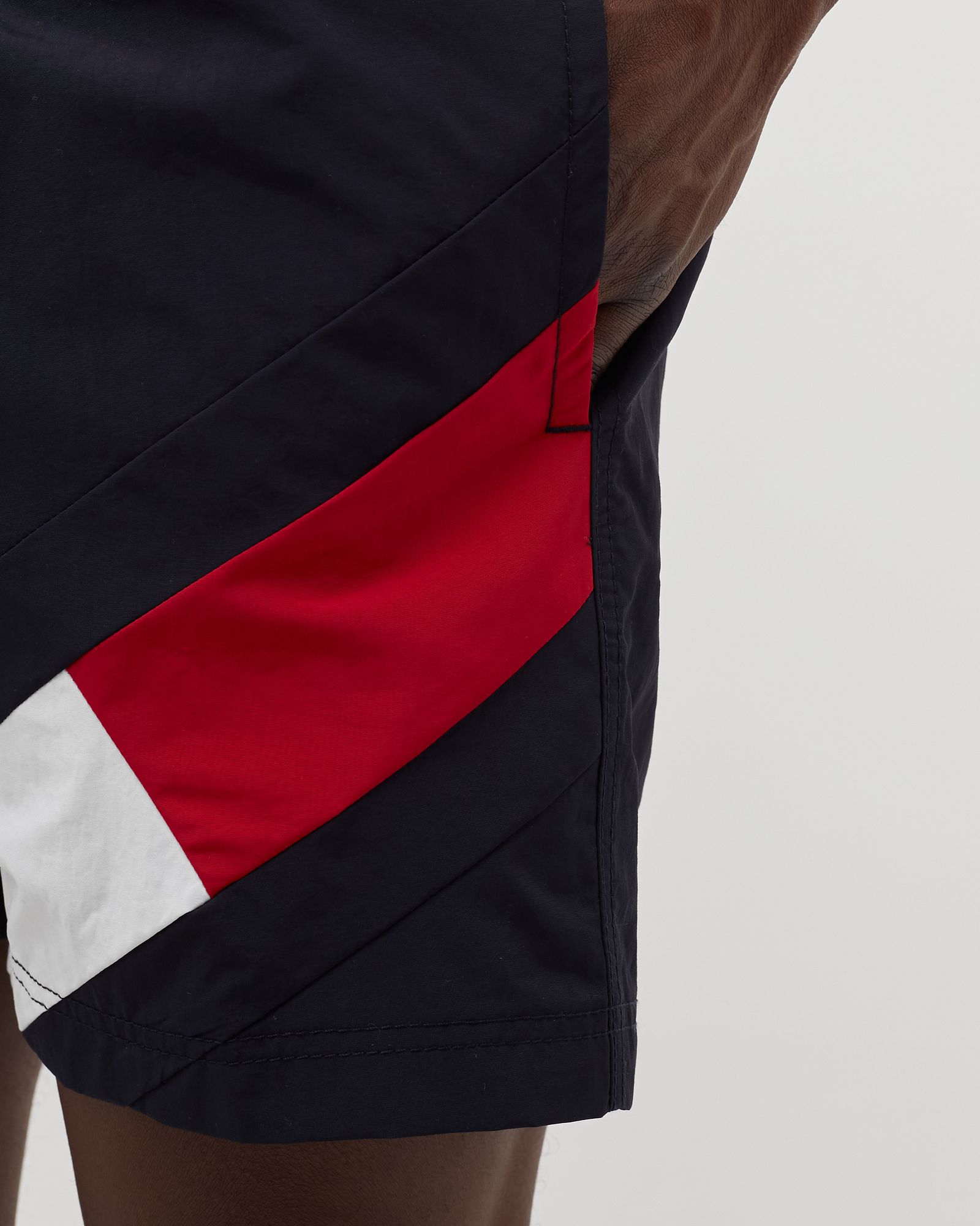 COLOUR-BLOCKED SLIM FIT MID LENGTH SWIM SHORTS