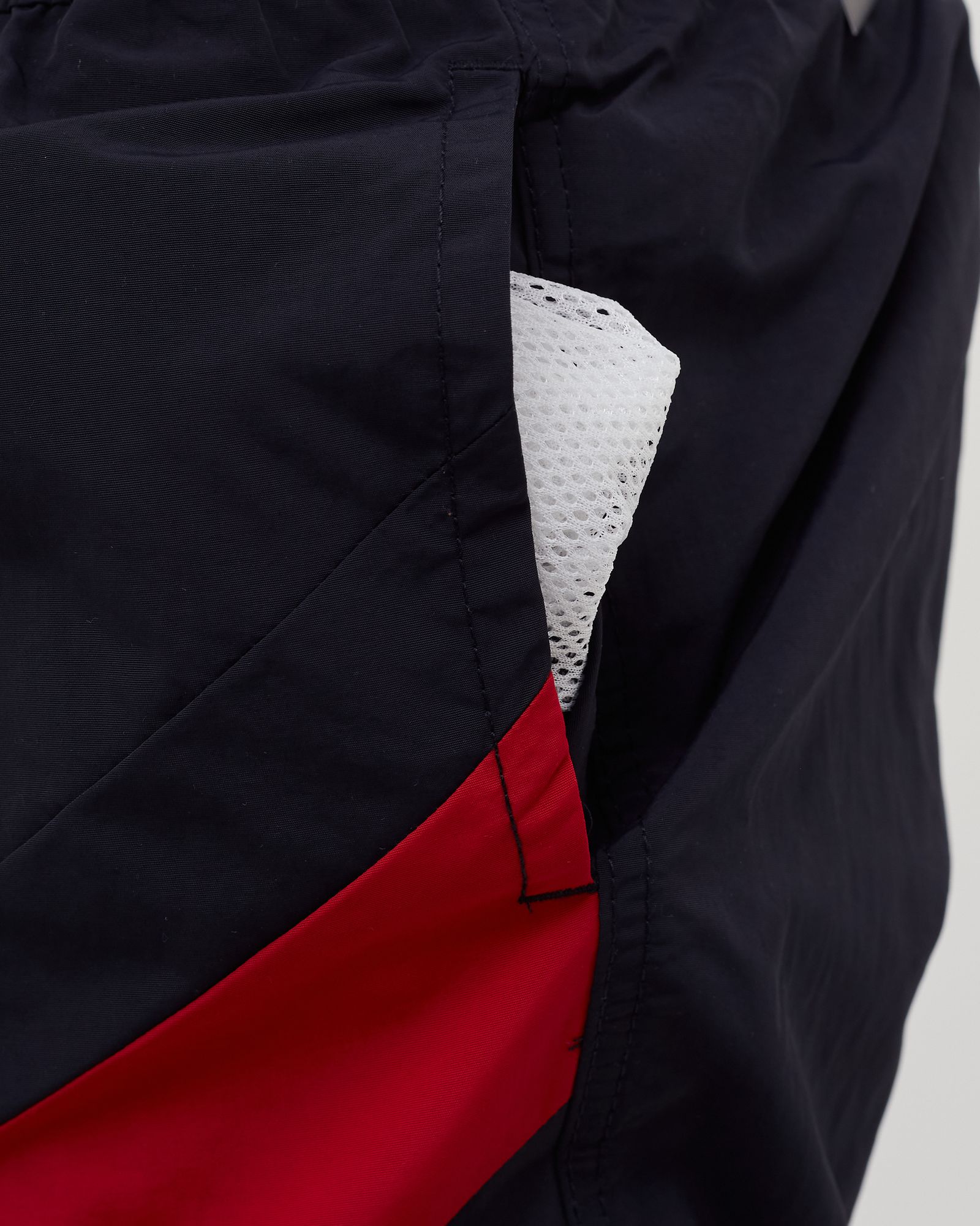 COLOUR-BLOCKED SLIM FIT MID LENGTH SWIM SHORTS