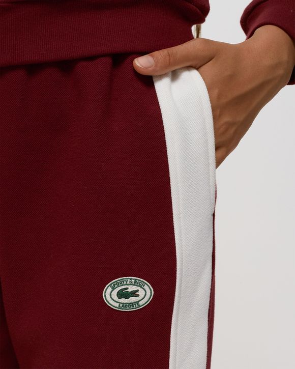 Red lacoste track online pants