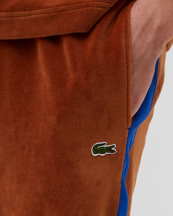 Orange on sale lacoste sweatsuit