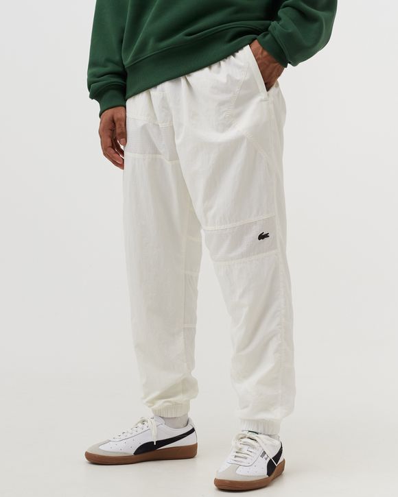 Lacoste track hotsell pants white