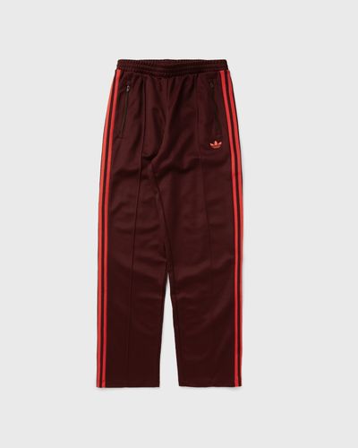 Adidas WMNS GRAPHIC CREST TRACKSUIT PANTS, purple